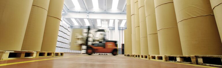 Huge spools of paper in warehouse of a printing company