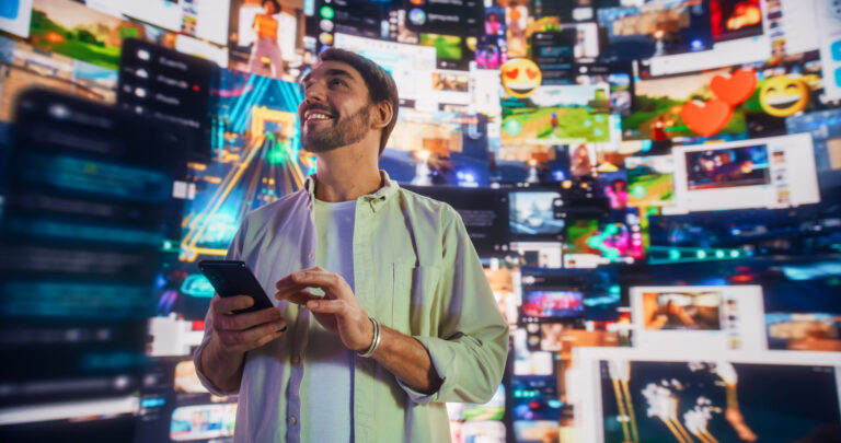 Portrait Of Caucasian Handsome Man Using Smartphone in 3D Cyberspace With Animated Social Media Interfaces, Video Games, Viral Videos, Internet Content. Visualization Of Blockchain Technology Concept