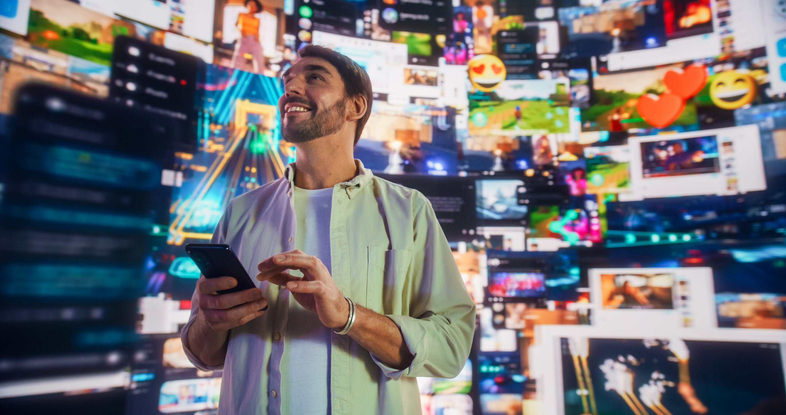 Portrait Of Caucasian Handsome Man Using Smartphone in 3D Cyberspace With Animated Social Media Interfaces, Video Games, Viral Videos, Internet Content. Visualization Of Blockchain Technology Concept